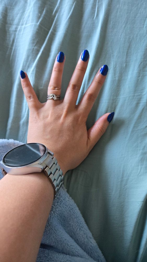 Hand with long, blue nails