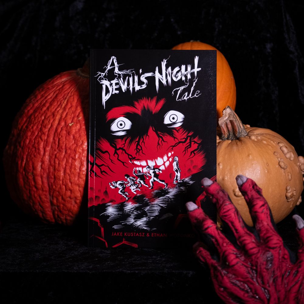 A Devil’s Night Tale by Jake Kustasz and Ethan Woronko being reached for by the hand of the Devil