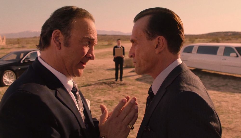 mitchem brothers in the foreground deciding not to kill dougie jones (background) if he has a cherry pie in that box he’s holding