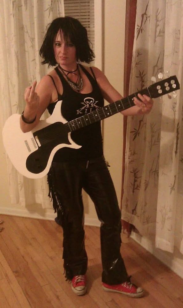 My costume is Joan Jett. I'm flipping off the camera.