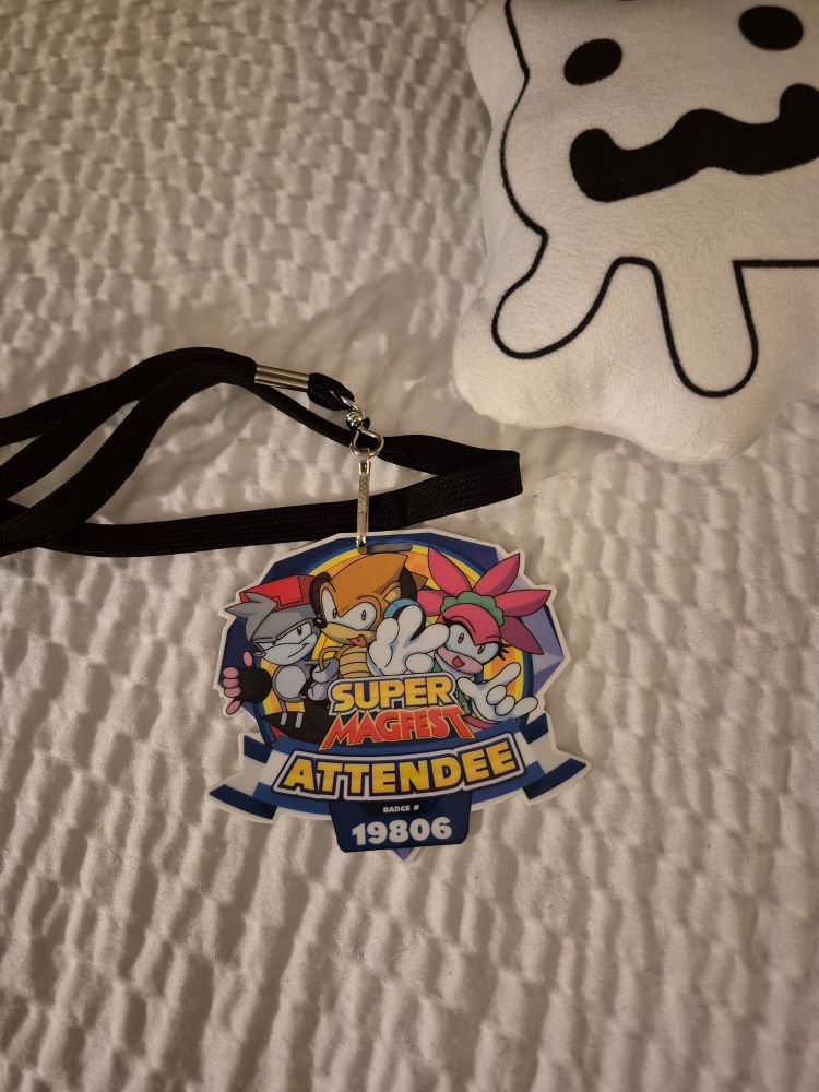 A MAGFest badge.
