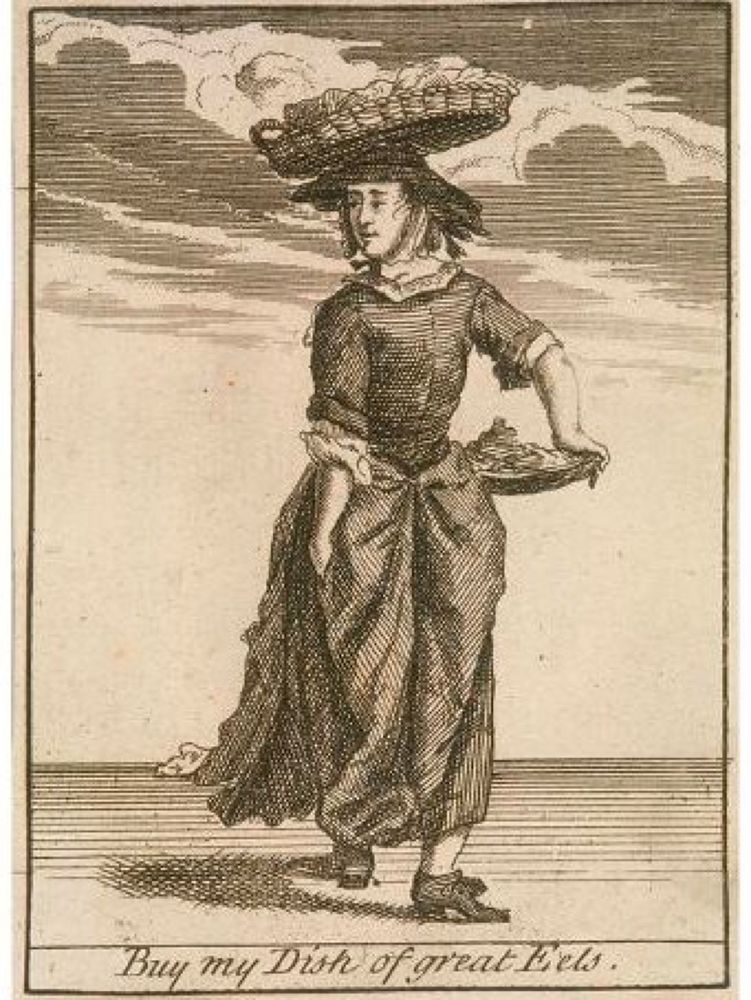 Woodcut of a woman selling eels, carrying them in a platter under her arm and in a basket on her head. She is very awkwardly posed; she is walking away from you, but a lot of her body posture looks like she's walking towards you, and she's looking backwards in a very uncomfortable way. It's as if her body is trying to do multiple contradictory things at once.

Her expression is quite calm, as if the presence of the eels has soothed the aches of her contorted body. All she really wants to to sell you some fish, and make it home in time to listen to her upstairs neighbors having sex. It's the little joys that make life worth living.

 The caption reads: "Buy my Dish of great Eels." Presumably "great" here means large, but I think we can assume that it also means amazing. This lady wouldn't sell anything less.