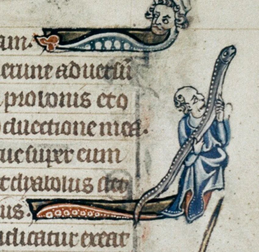 Medieval marginal art showing a man holding a very large eel, and looking somewhat lustily at it. He is waring a blue robe, and he is bald on the top of his head. He's cradling the eel, and holding it up as if to kiss it, or study it closely. Or bite it. His mouth is open, so you never know. The man doesn't have legs, and the drawing ends in something that looks like an interlinear octopus tentacle. Is this an early form of tentacle porn? * Reasonable scholars will all agree that it is. In any event, you should never trust this man with either your eel or your child. It will end badly, no matter what. At the top of the page is another smaller drawing of a man's head at the end of something that looks like the body of a snake that ate a capybara. The man has a beard, and is looking back at his body as if to say, 