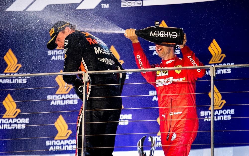 max verstappen and sebastian vettel celebrate on the podium after the 2019 singapore grand prix, september 2019. 
