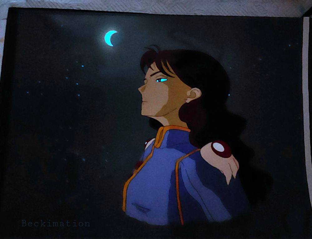 The same image as before except at night time. Both his eyes and the moon are now glowing with a soft blue hue. Also, slight blue stars can be seen shining as well. 