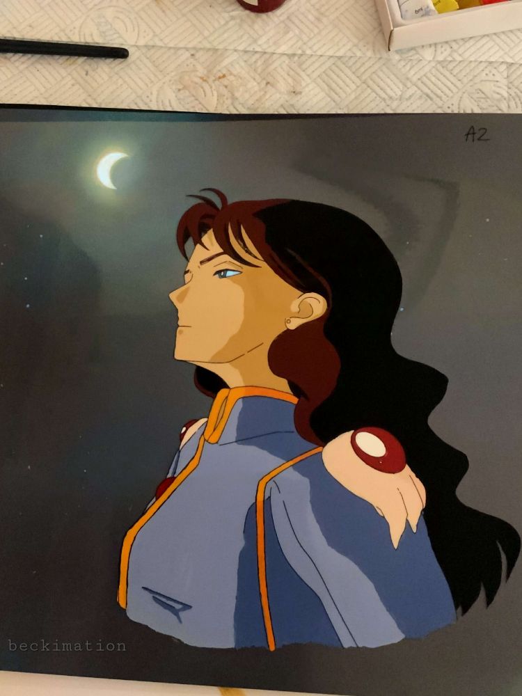 An animation cel of the Sailor Moon character "Nephrite." He has long wavy hair and a lilac jacket. He is looking to the left and above him in the sky is a crescent moon. 