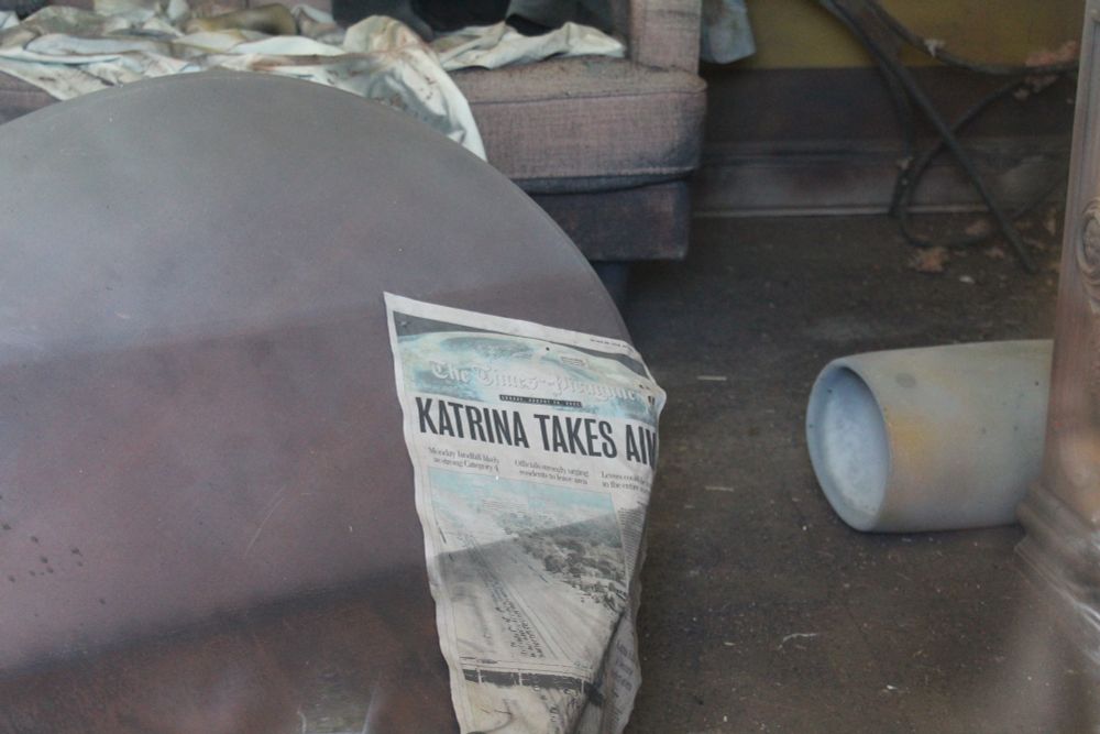 Newspaper labeled, “Katrina Takes Aim.” This newspaper is dated: August 28th, 2005. 