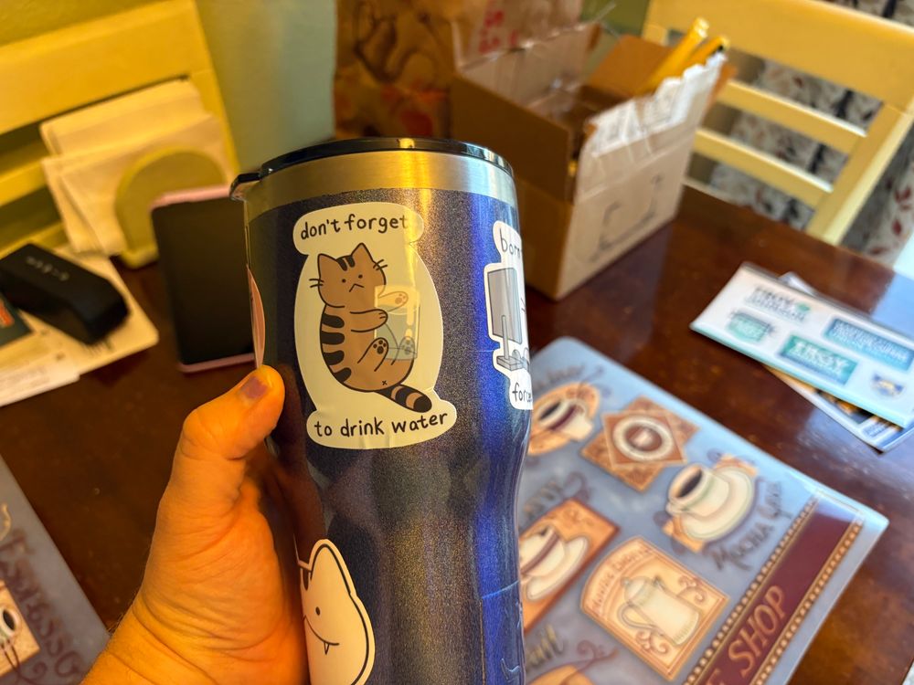 Cup with cute cat stickers