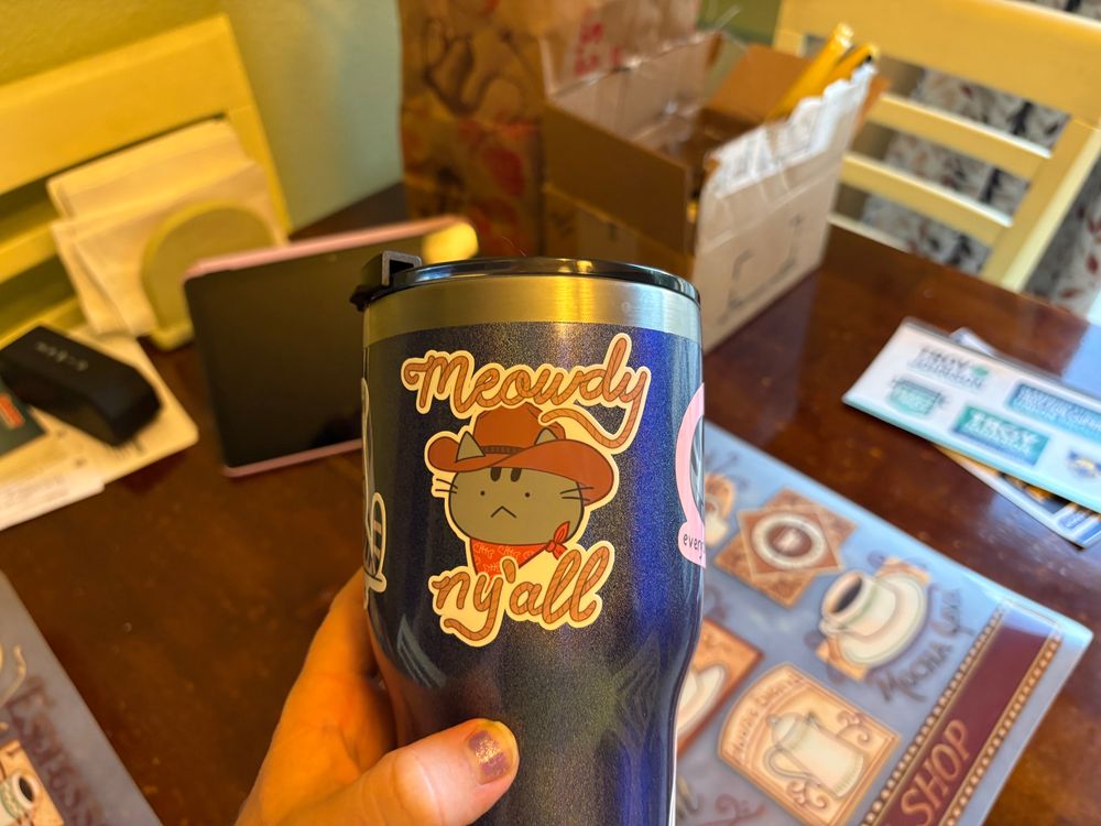 Cup with cute cat stickers