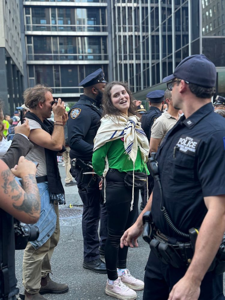 Photo shows Rabbi Abby Stein being arrested 