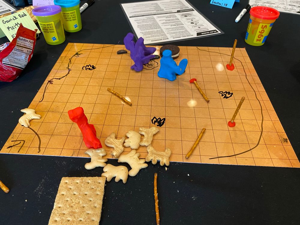 Battle map for a game of daggerheart using a variety of food for minis and terrain