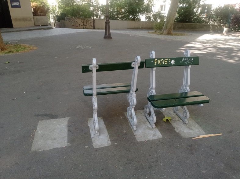 Two bench seats facing opposite directions. Looks as if a full size bench was cut in half.
