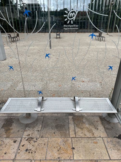 A bench with two handles fixed to the seat
