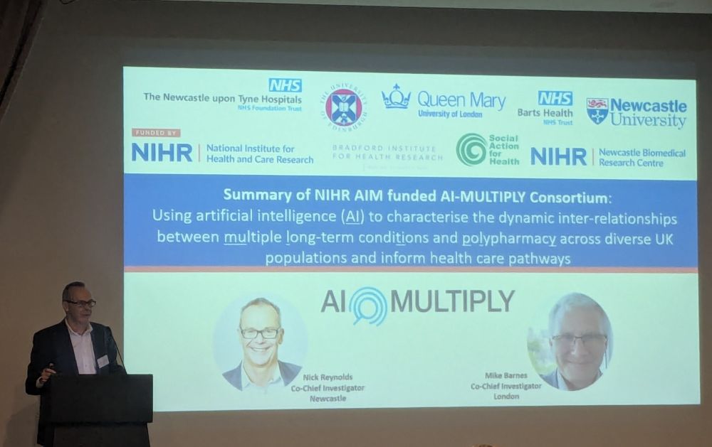 Nick Reynolds on stage presenting findings from the AI MULTIPLY project.