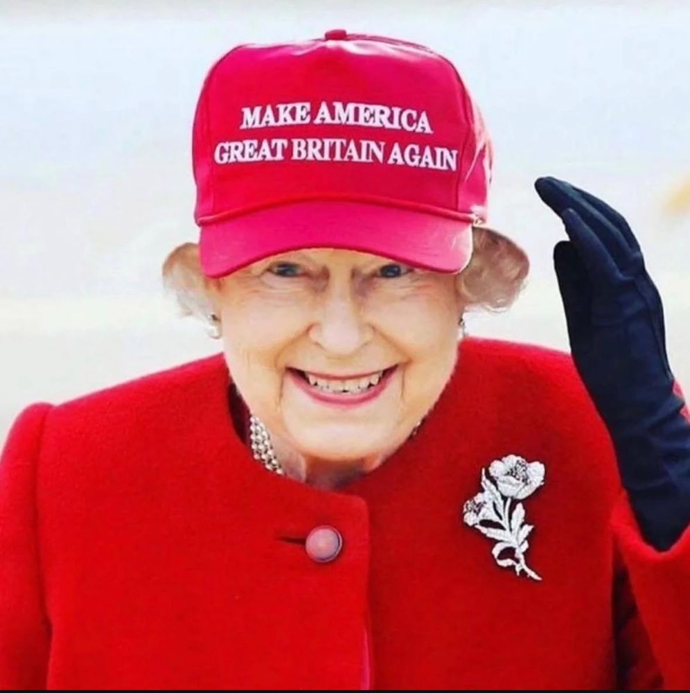 The Late Queen wearing a red baseball cap that says MAKE AMERICA
GREAT BRITAIN AGAIN