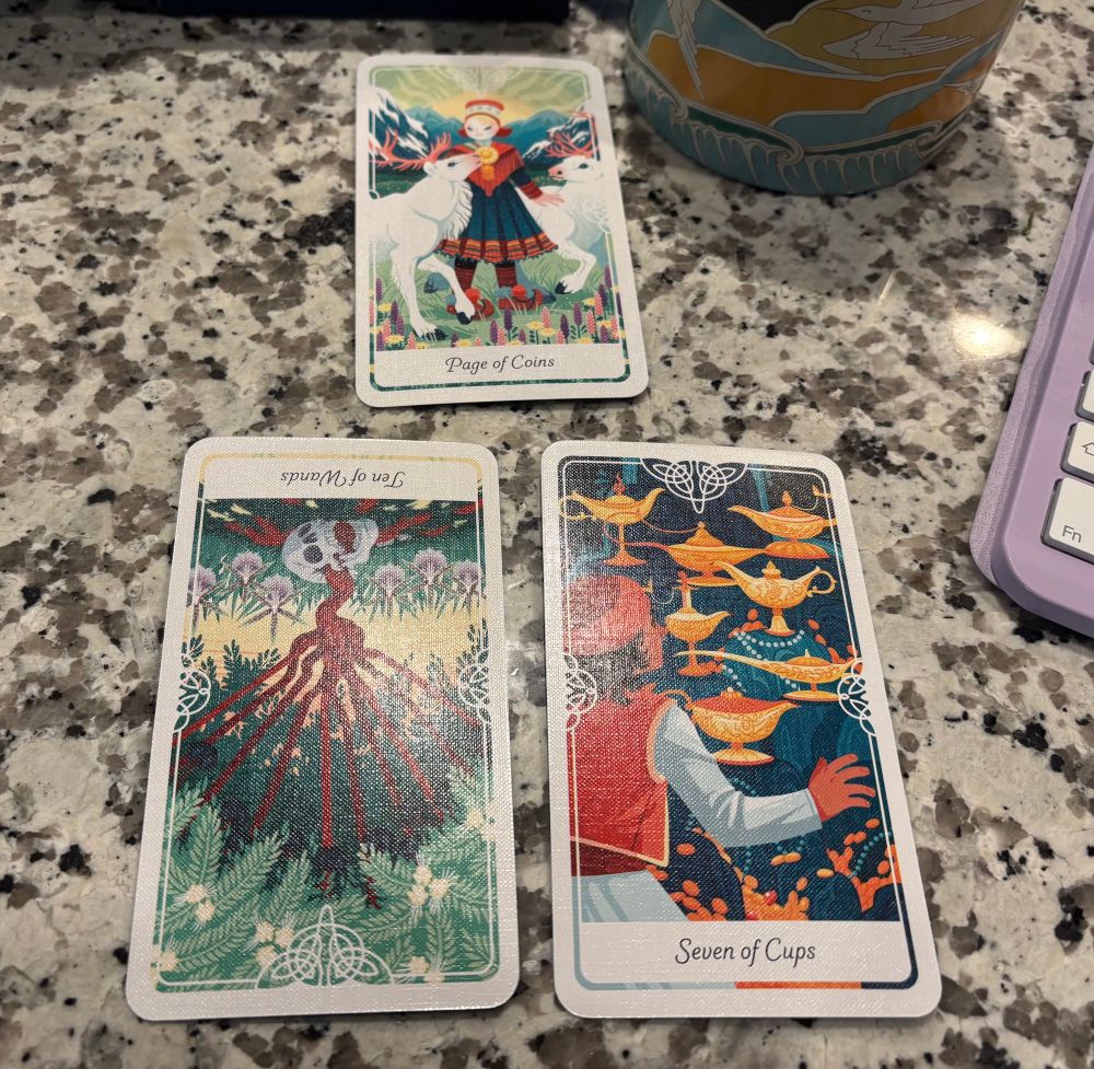a three card tarot spread with a folk tales and fairy tales motif. upright page of coins is in the top position with reversed ten of wands and upright seven of coins beneath from left to right 