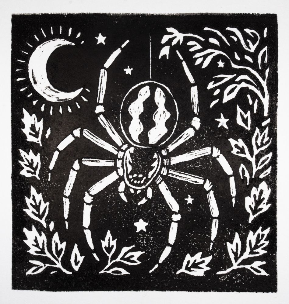 A black and white linocut block print of an orbweaver spider in front of a night sky with leaves around the border.