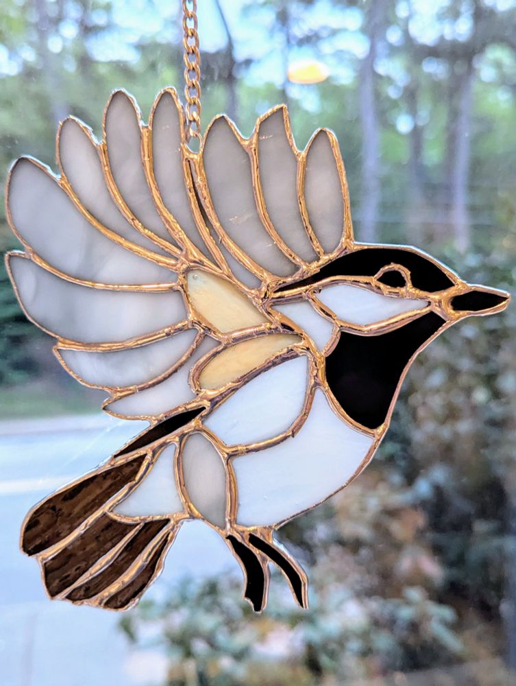 Stained glass black capped chickadee 