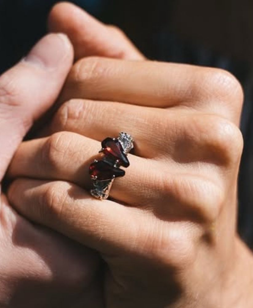 pic of bbno$ hand cosplaying taylor getting engaged. the ring is two brown gems that look like coffin shapes. 

so very meta, love u bbno$ 
