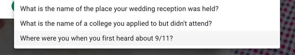 A screenshot showing a dropdown menu of security questions, with the following question highlighted: "Where were you when you first heard about 9/11?"