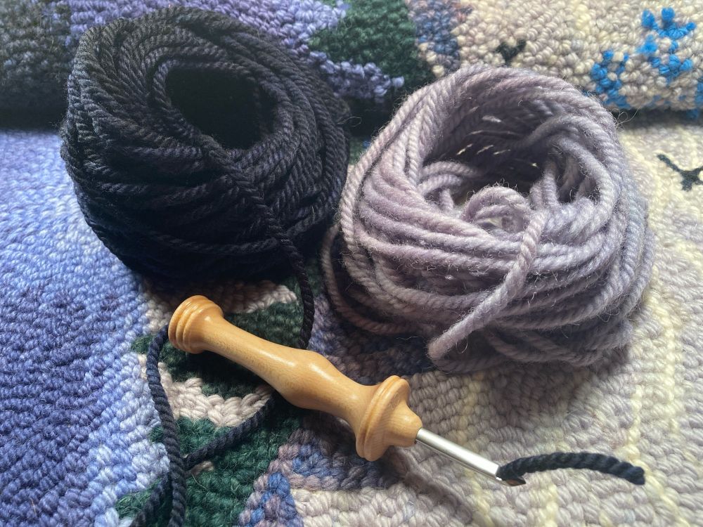 Three ply yarn threaded through an Oxford punch needle. 