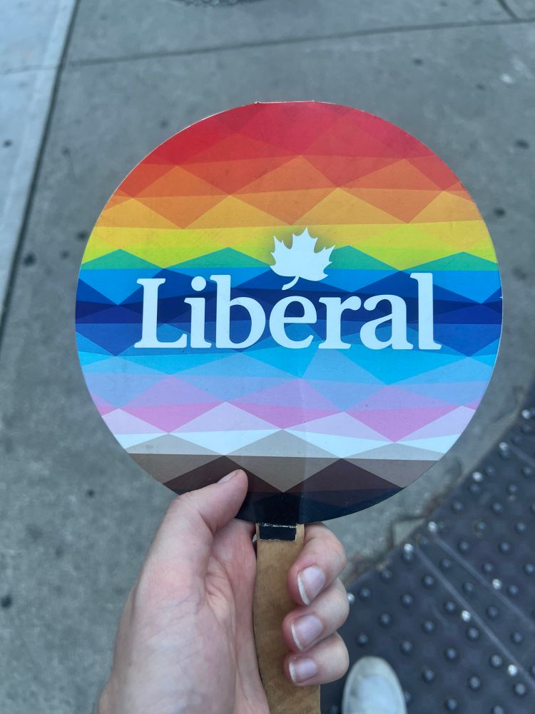 A fan I got with pride colors and the word “Liberal” on it.