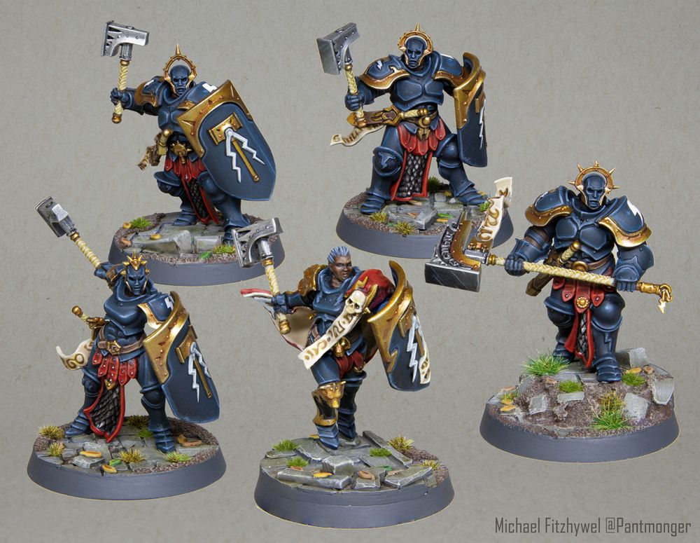 5 black clad liberator miniatures.