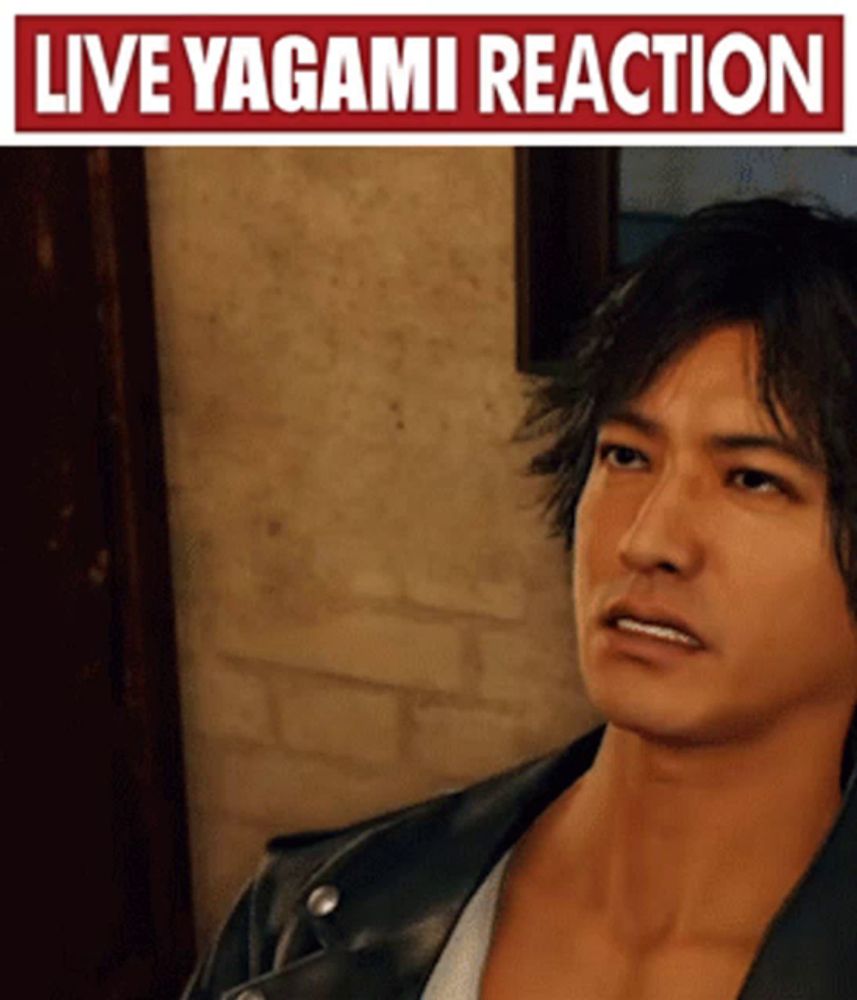 a man in a leather jacket is standing in front of a sign that says " live yagami reaction "