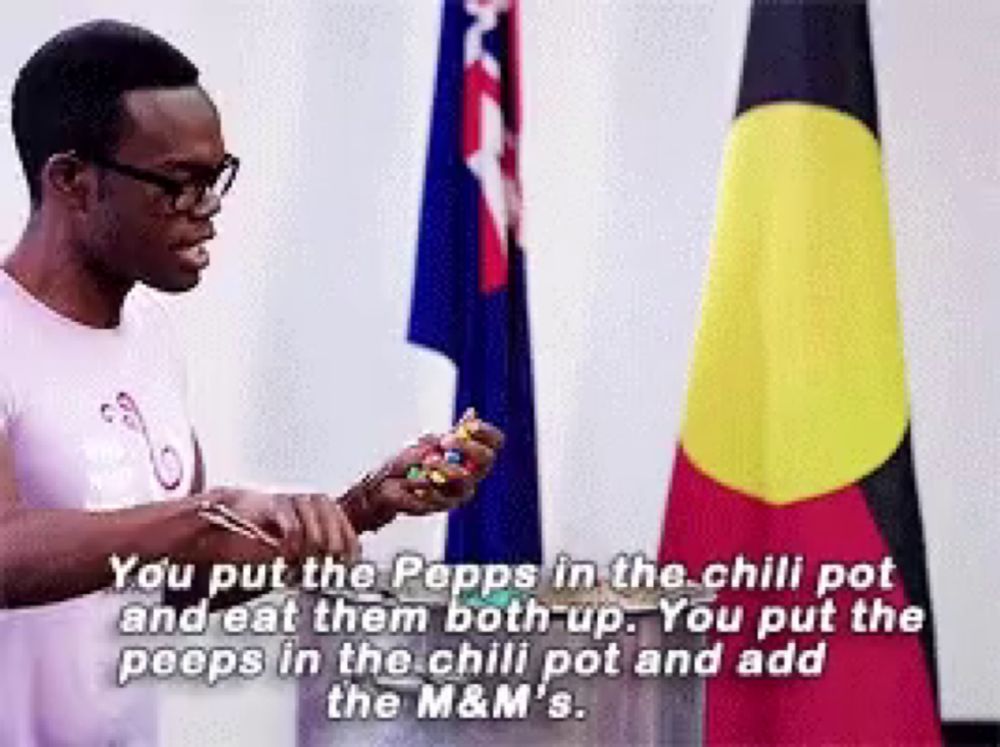 a man standing in front of a flag with a caption that says " you put the pepps in the chili pot and eat them both up "