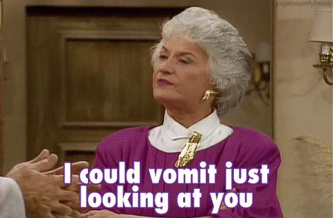 Animated GIF of the character Dorothy from the TV show Golden Girls sitting at a table across from an unseen second person. Dorothy has a disgusted look on her face and is speaking. She says "I could vomit just looking at you." That text is imprinted in the bottom third of the image.