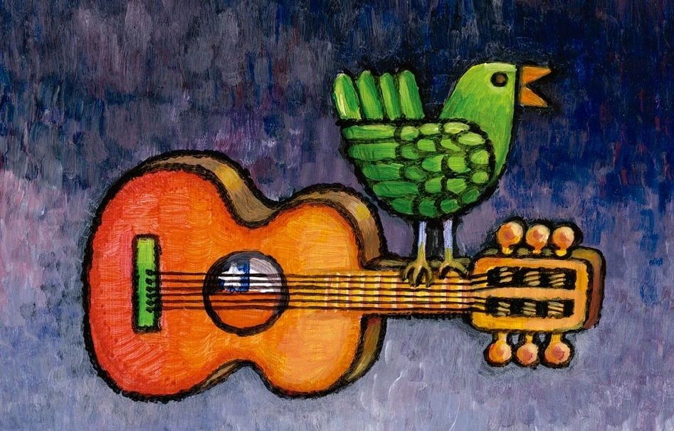 A painting of a green bird on the board of a horizontally placed guitar.