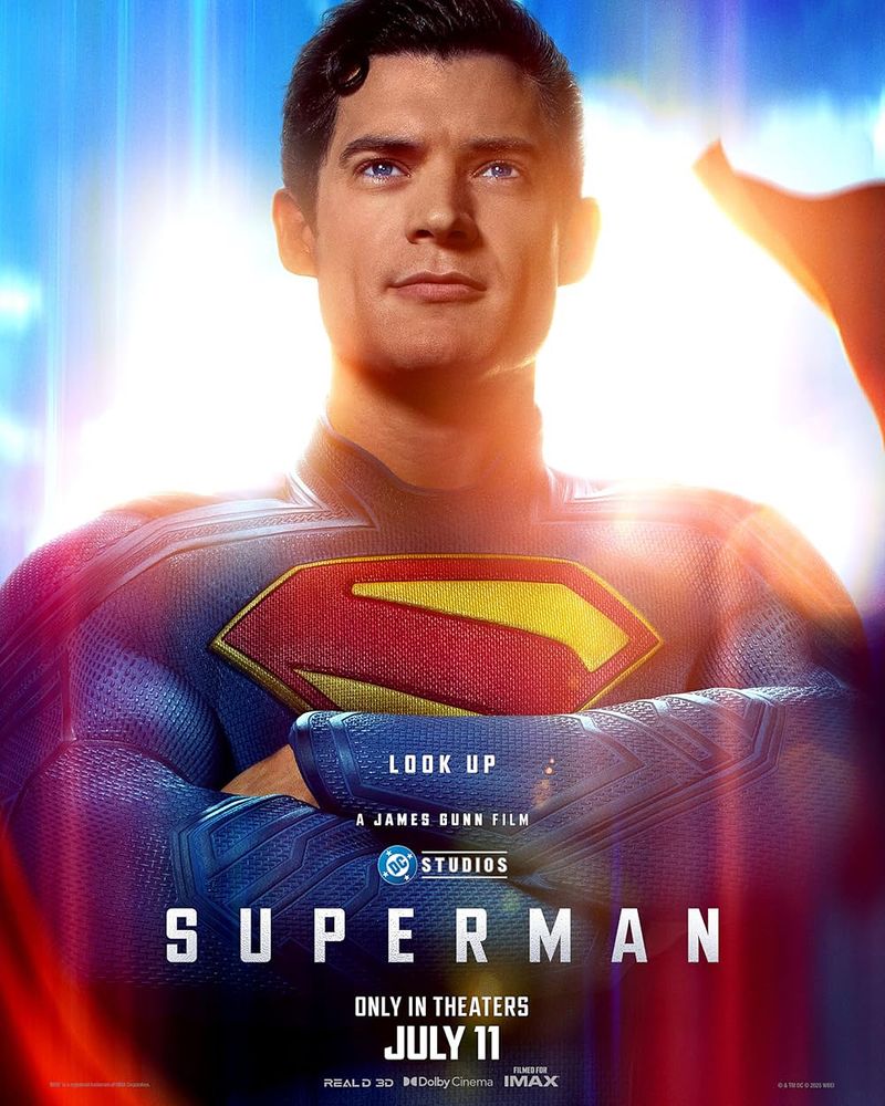 Poster for Superman (2025) showing David Corenswet with arms folded