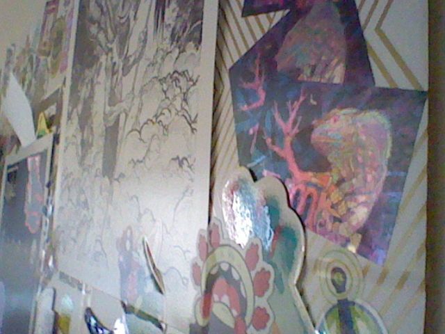A bunch of stickers and various pictures from my "vibe" wall