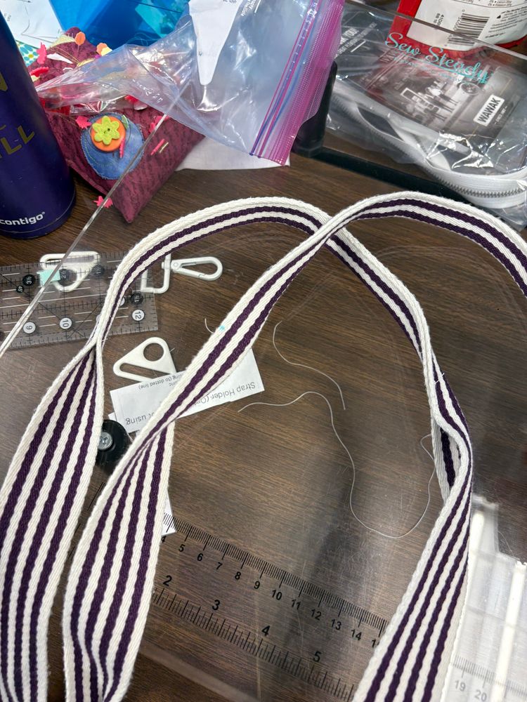 purple and white handles for a bag