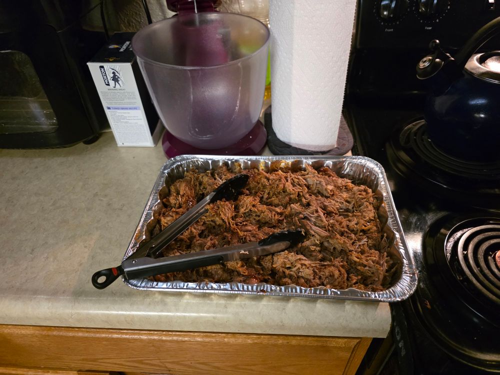 A 13 by 9 inch pan of pulled pork, took 10 hours to cook in a slow cooker. The texture is meaty, lightly greasy and the taste very sweet.