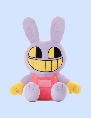 a stuffed bunny with a yellow face is sitting down