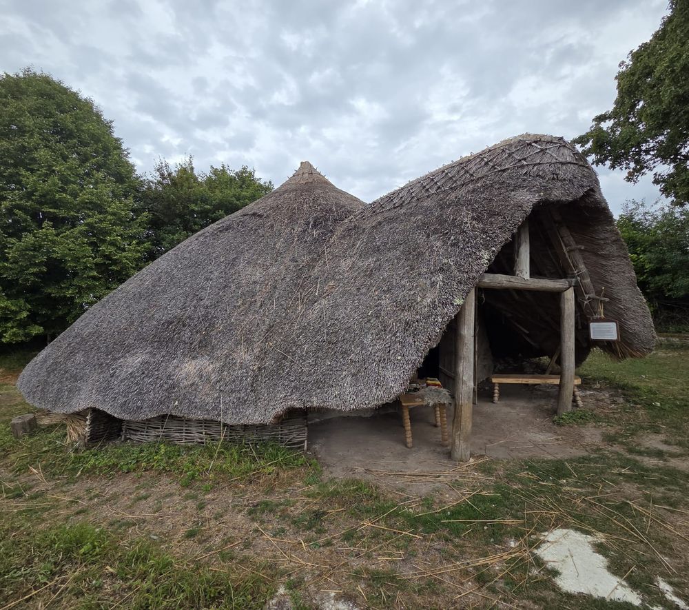 Recreation Iron Age roundhouse with thatched conical roof