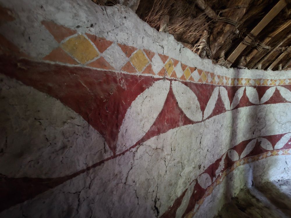 Imagined painted interior decor of a reconstruction Iron Age roundhouse