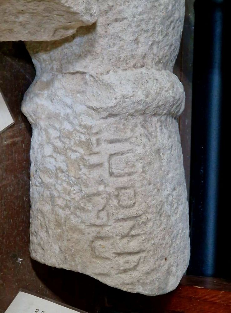 Part of a Roman stone column inscribed with Latin text