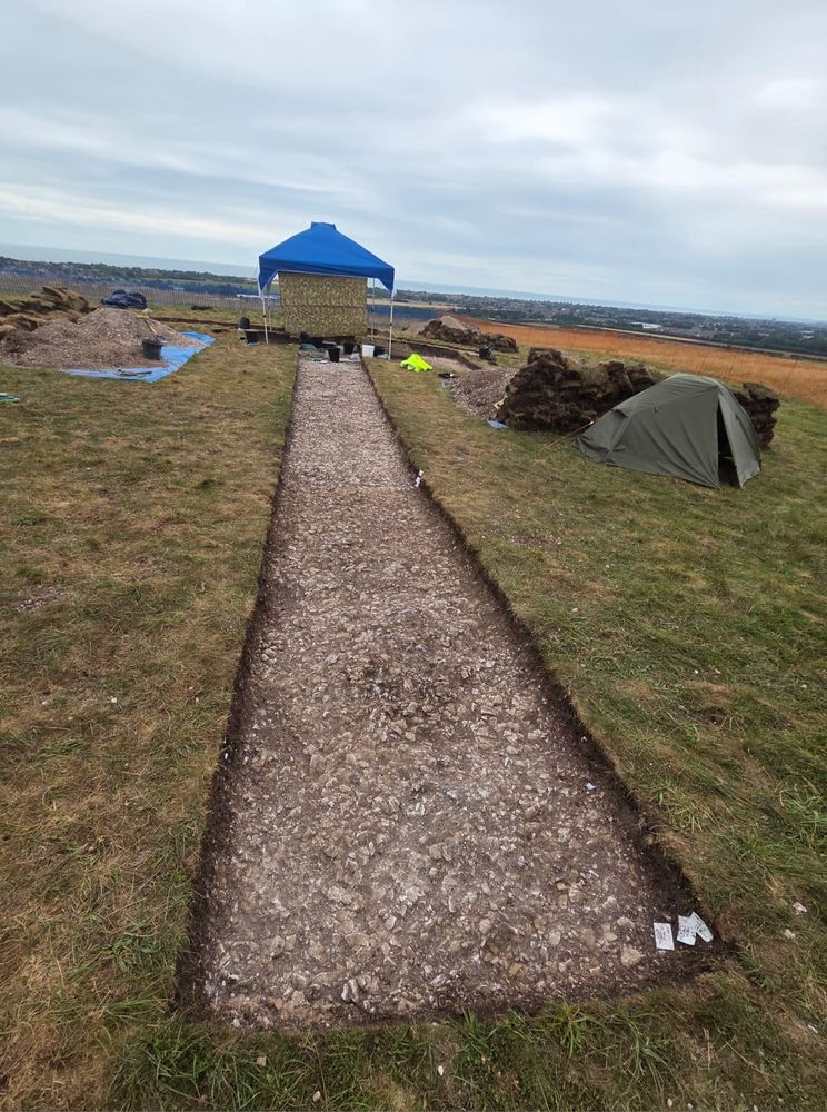 An archaeological trench, cut down to chalk geology