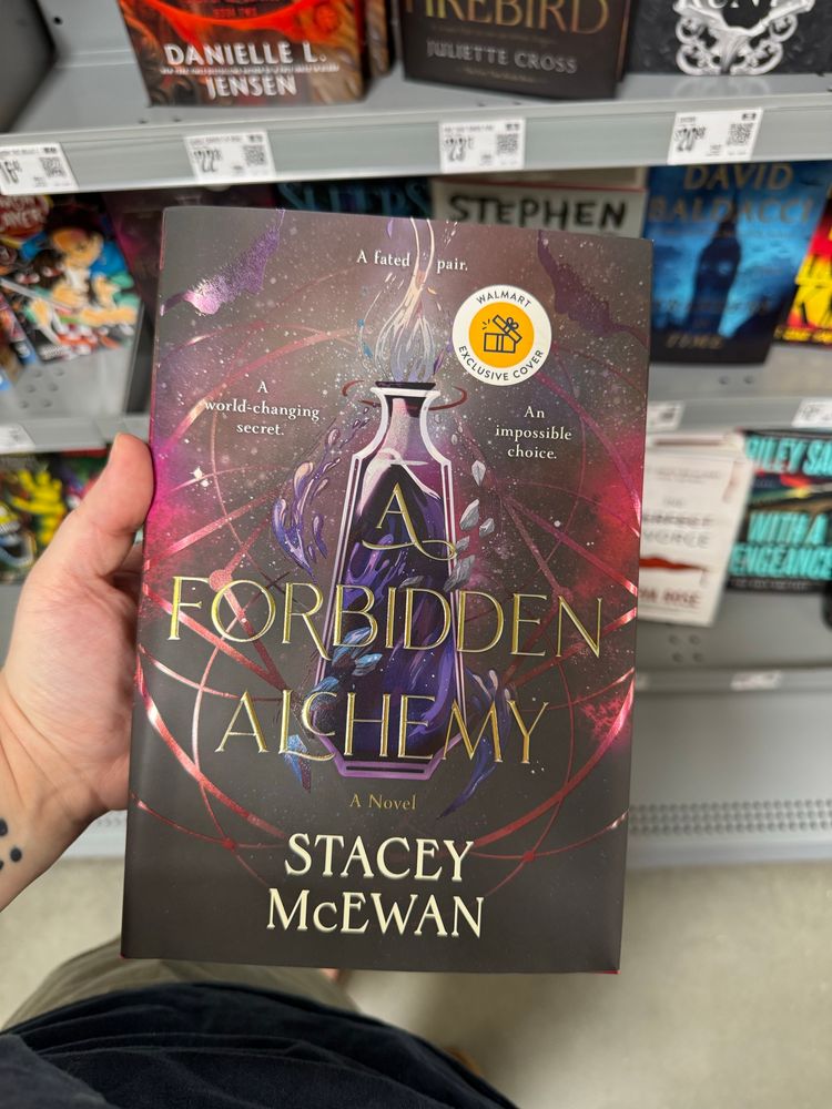 photo of book “a forbidden alchemy” with a fake Walmart sticker on it 