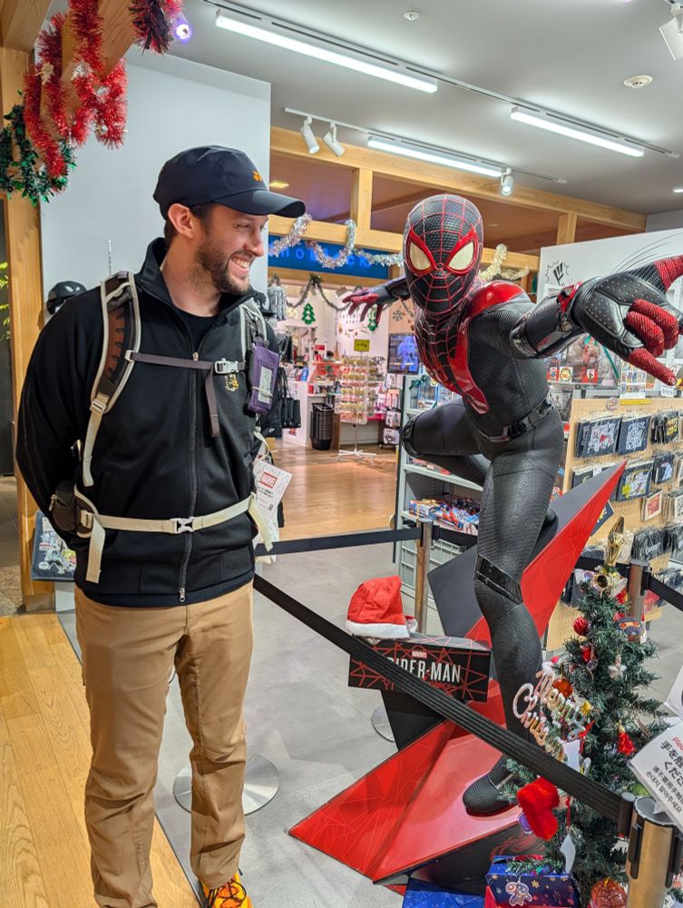 Sam lovingly looking at mile morales