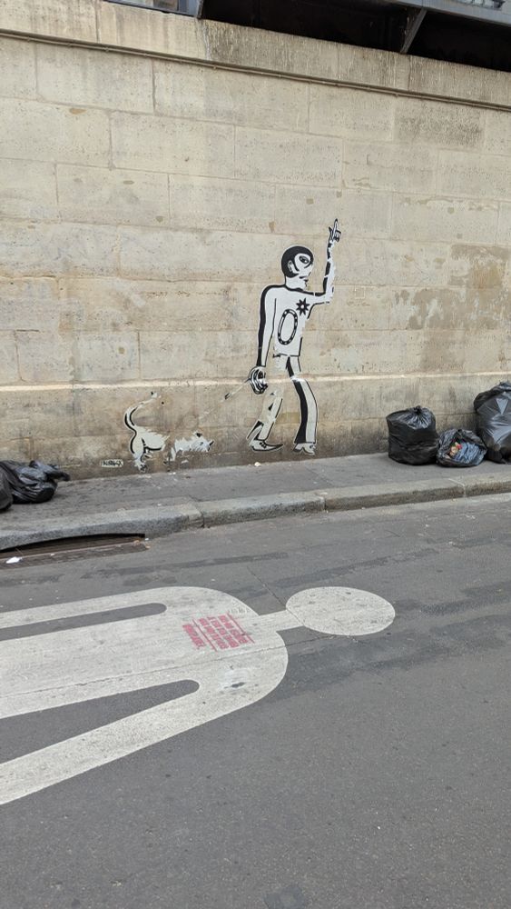 A giant paste up of a man on a wall