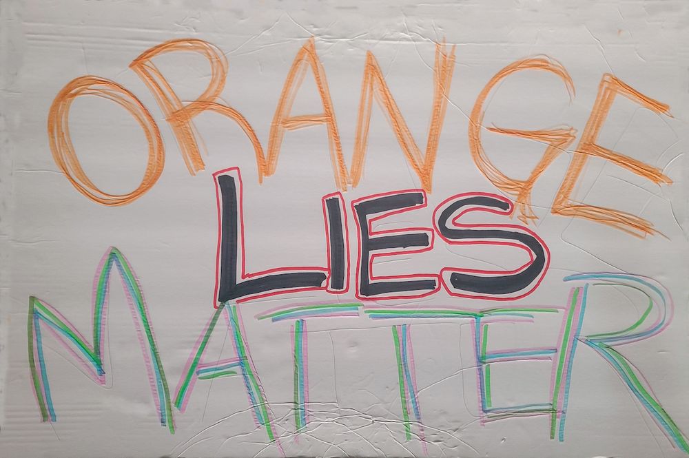 April, 2025 Hands Off protest sign that says "Orange Lies Matter"