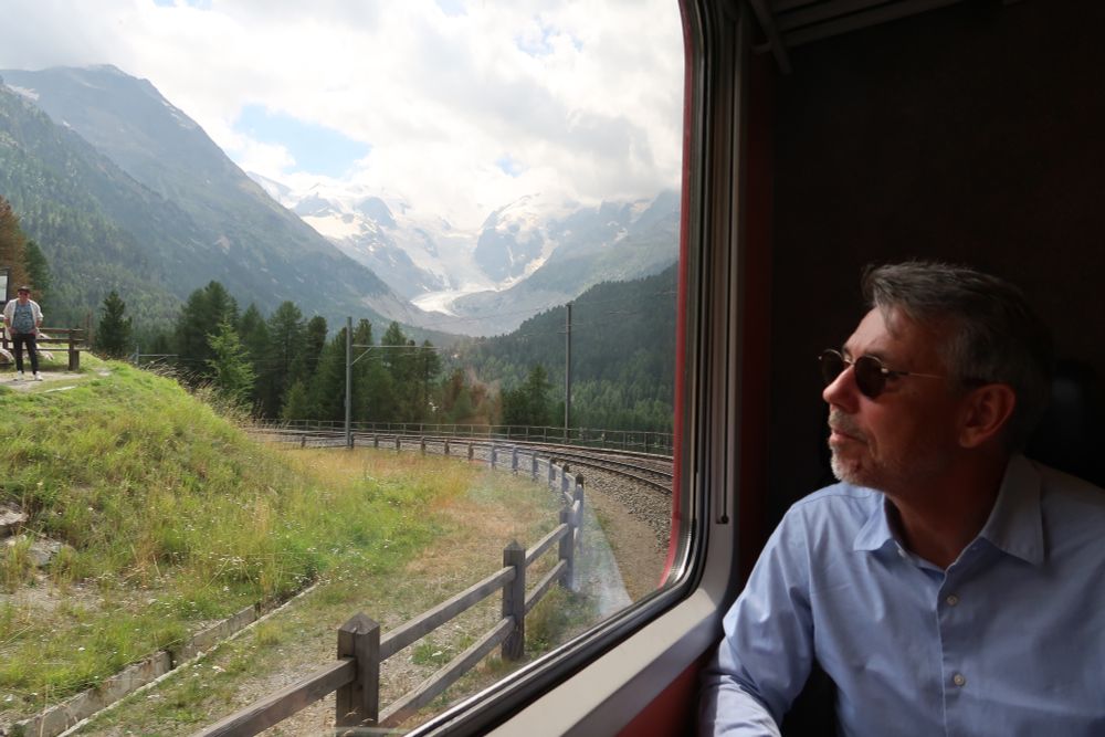 Man watching the view from a train
