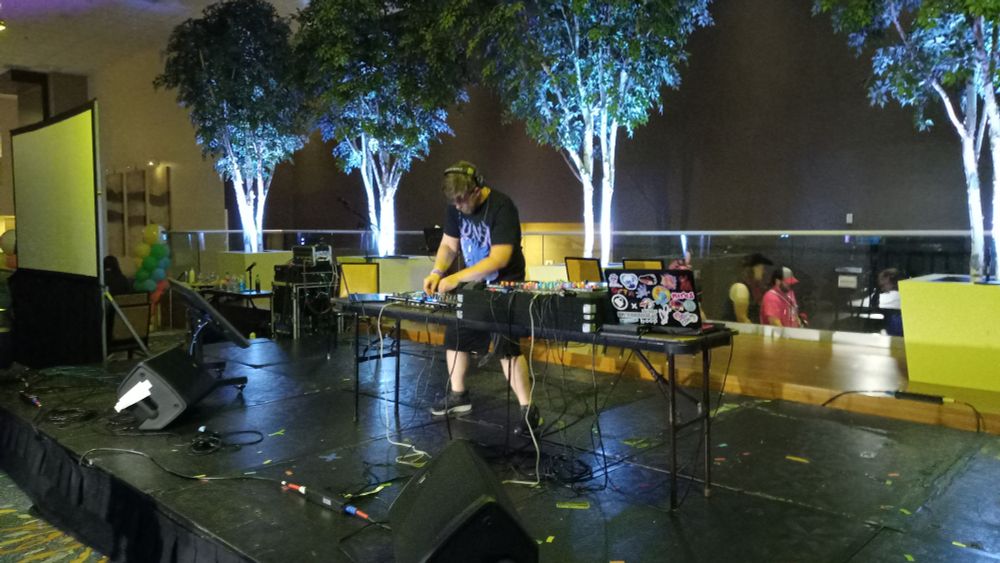 Musician Trey Husk performing live onstage at TrotCon 2025