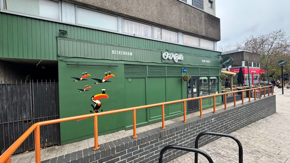 O'Neil's pub, new paint job in all green. There's some painted toucans on the side mid-flight carrying pints of Guinness on their beaks