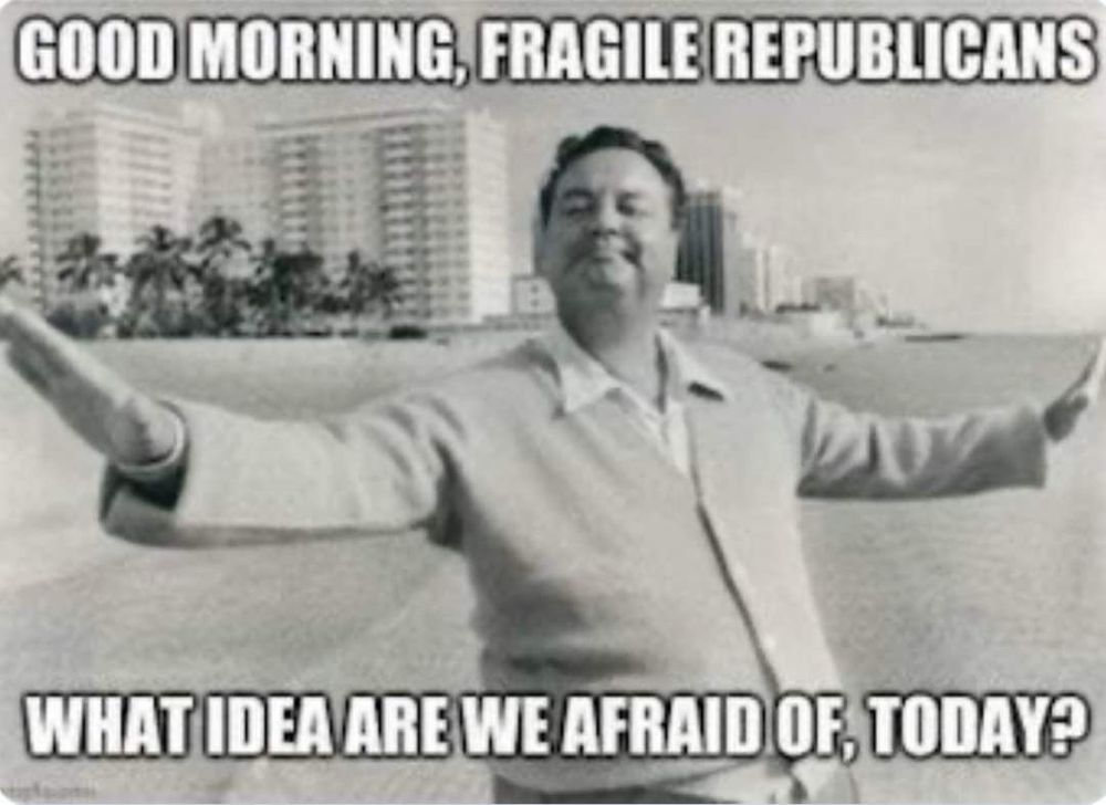 Black and white photo of a man in a golf sweater with his arms outstretched on a beach. 

The text overlay reads:  GOOD MORNING, FRAGILE REPUBLICANS
WHAT IDEA ARE WE AFRAID OF, TODAY?
