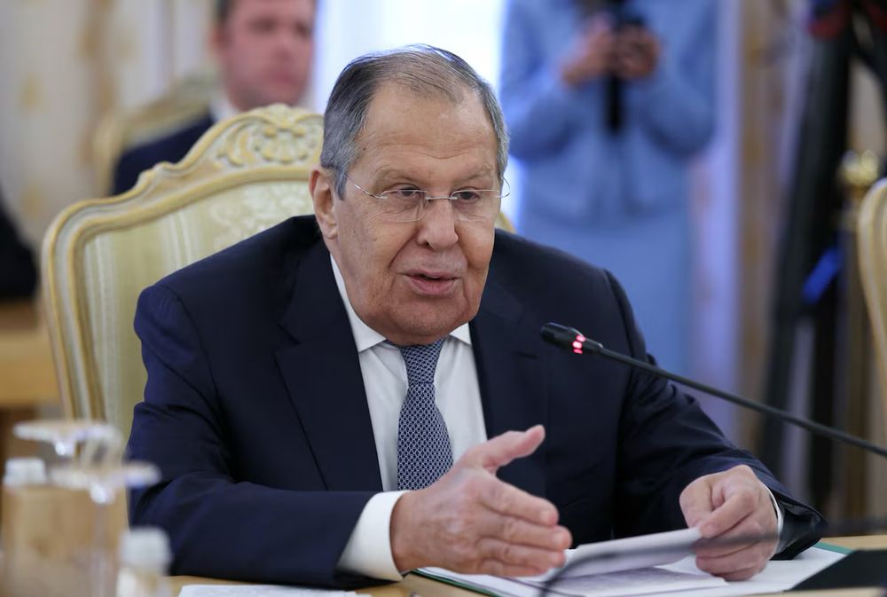 Russian Foreign Minister Sergei Lavrov speaks during a meeting with his Kazakh counterpart Ermek Kosherbayev in Moscow, Russia, October 22, 2025. Photo credit: REUTERS. 

Man with glasses in a dark suit sitting in an upholstered high back French chair holding papers and speaking into a desktop microphone.