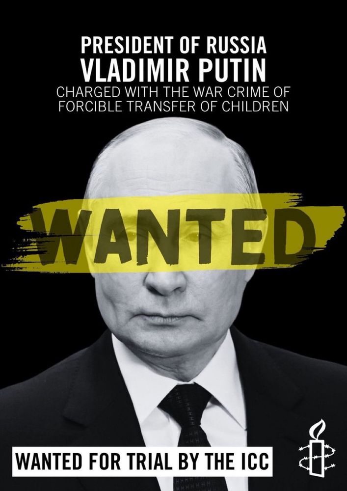 PRESIDENT OF RUSSIA VLADIMIR PUTIN CHARGED WITH THE WAR CRIME OF FORCIBLE TRANSFER OF CHILDREN WANTED WANTED FOR TRIAL BY THE ICC Man in a black suit and black tie with a yellow “WANTED” banner across his eyes 